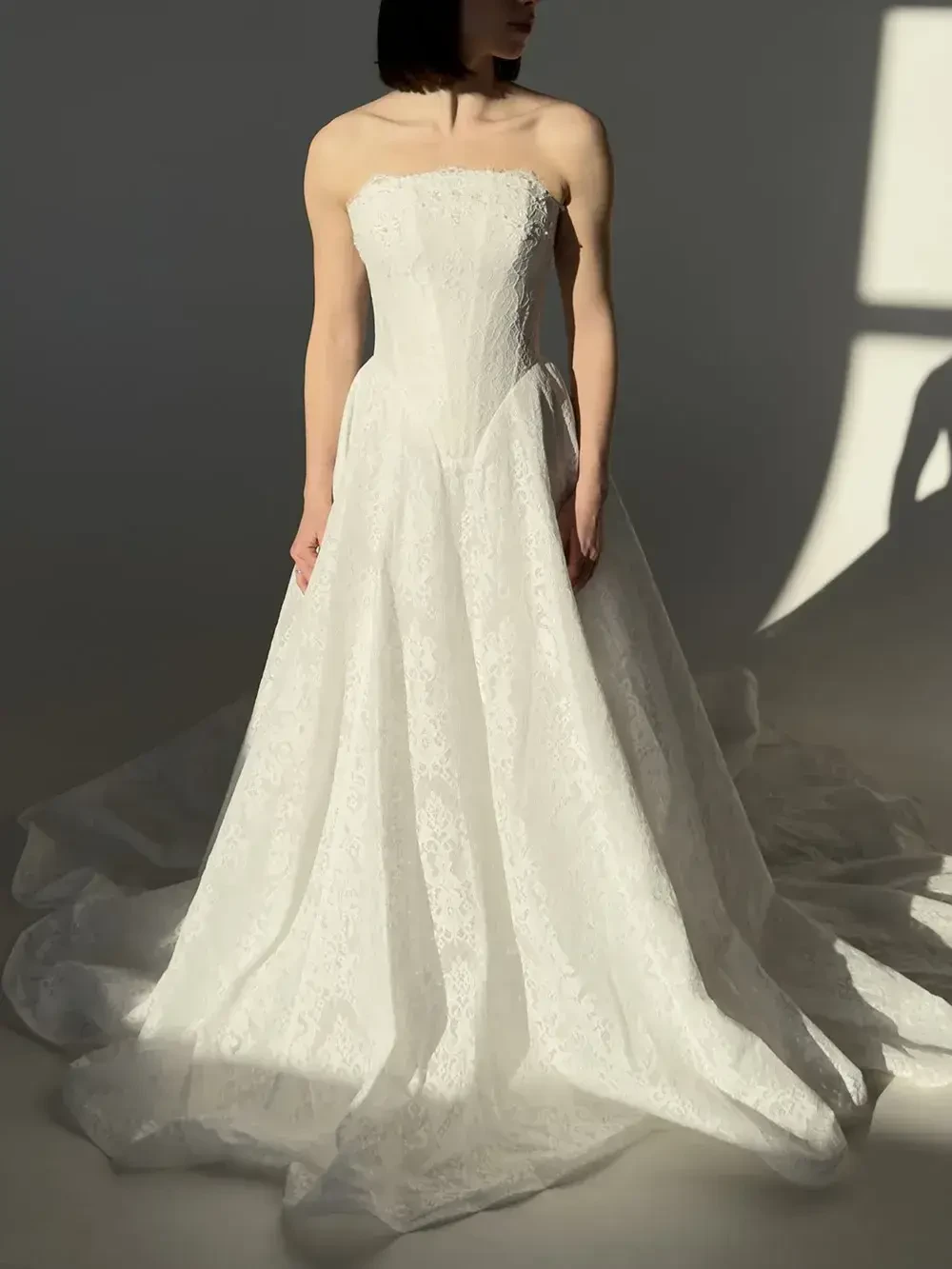 model is wearing a strapless bridal gown