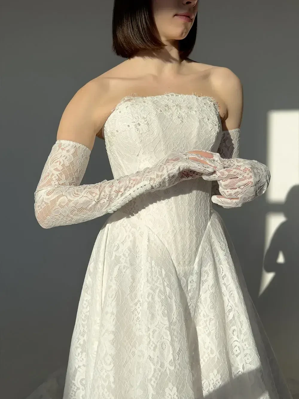 model is wearing a strapless bridal gown